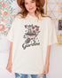 Model wearing ivory color shirt with 'Find Me In The Garden' graphic design